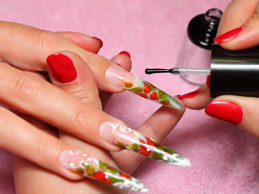 Painting acrylic nails.